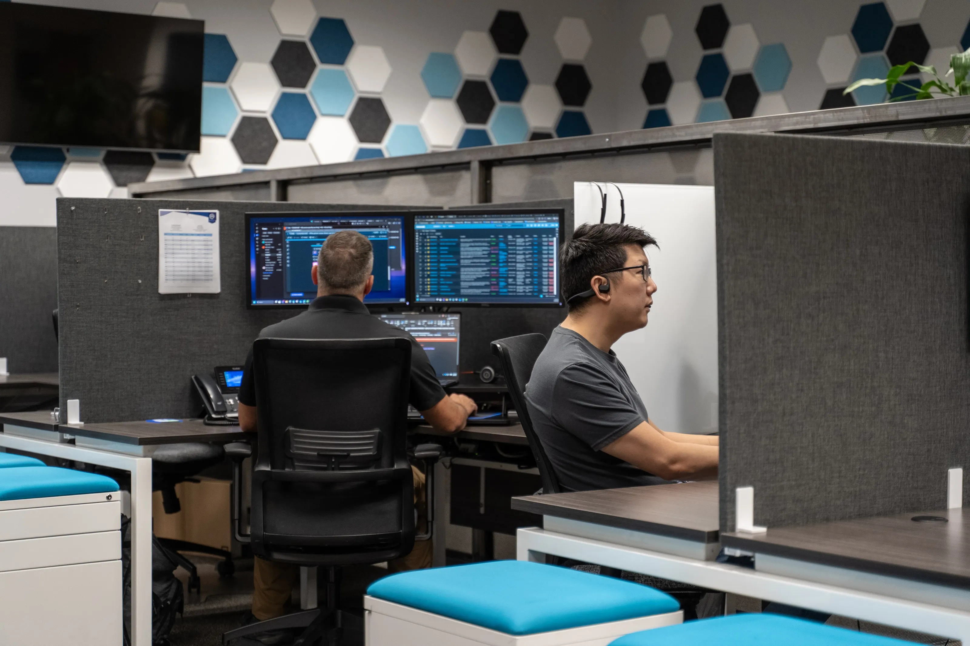 Marcus Networking help desk technicians working tickets at their monitoring stations